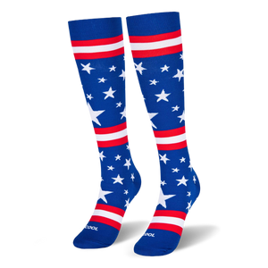 Blue knee-high socks standing upright, featuring white stars and red and white stripes across the leg and foot area.