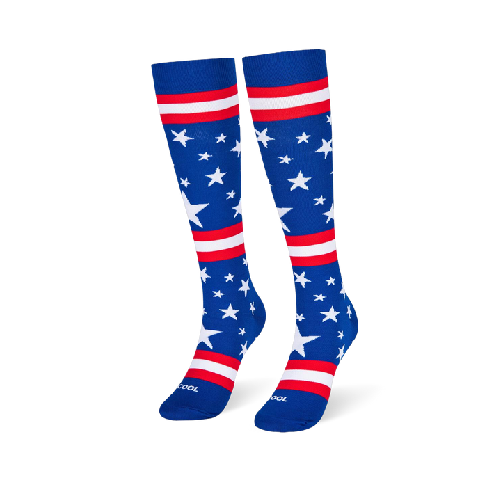 Blue knee-high socks standing upright, featuring white stars and red and white stripes across the leg and foot area.