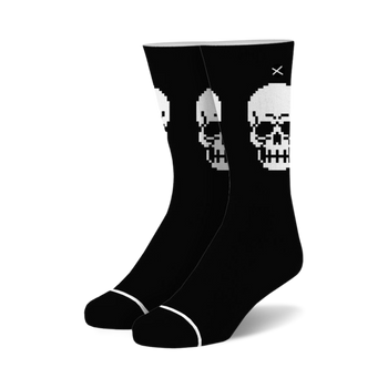black crew socks with a pixelated skull design in white with a black outline. 