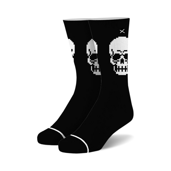black crew socks with a pixelated skull design in white with a black outline.  }}