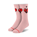 Pair of blush pink crew socks with a graphic of three pixelated hearts; two whole, one broken.  Red and black pixel art on a light pink background.
