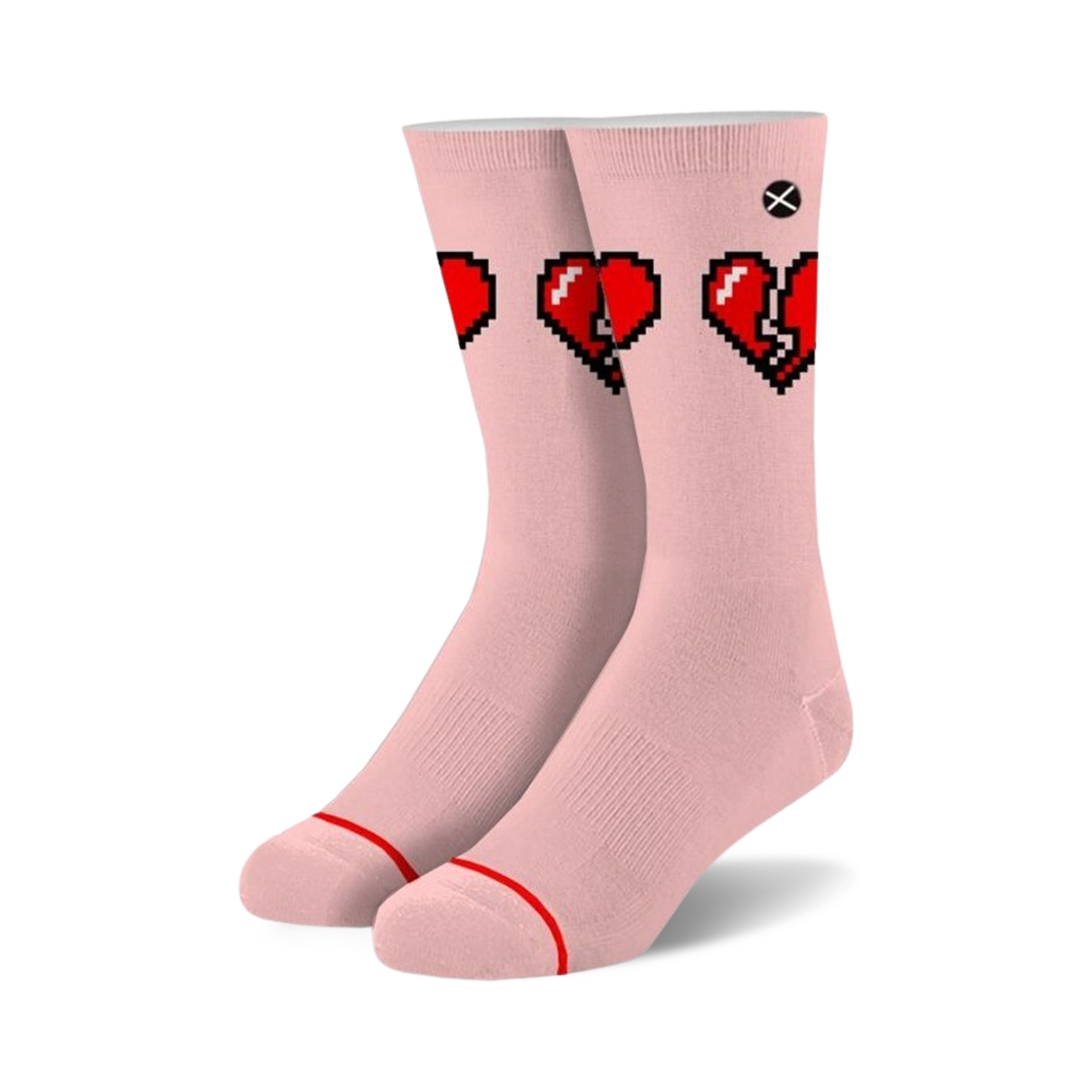 Pair of blush pink crew socks with a graphic of three pixelated hearts; two whole, one broken.  Red and black pixel art on a light pink background.