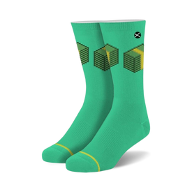 pixel money stacks crew socks in green feature 8bit yellow money stack pattern with black outline. unisex novelty socks for men and women.   