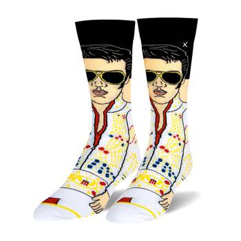 Pair of crew socks featuring Elvis Presley in his white eagle jumpsuit with sunglasses and a microphone. Black, white, gold, red, blue.