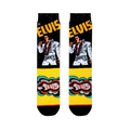 Flat lay of Elvis crew socks showing the King in his white jumpsuit on a black leg, with a bright yellow retro foot design.