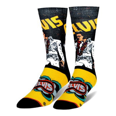 Crew socks featuring Elvis in a white jumpsuit with a lei on a black background, plus retro yellow and blue graphics on foot.