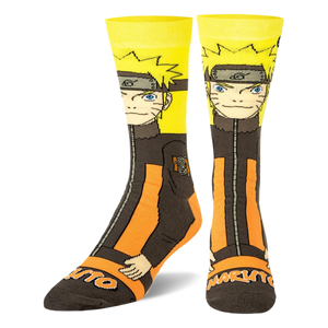 Crew socks angled to show Naruto's orange and black suit design wrapping around the side, with Naruto text on the dark toe.