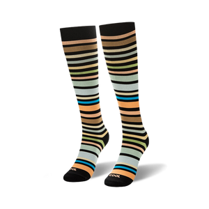 Knee-high socks featuring horizontal stripes in brown, peach, green, light blue, and bright teal on a black background.