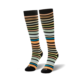 Knee-high socks featuring horizontal stripes in brown, peach, green, light blue, and bright teal on a black background.