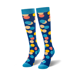 Pair of knee-high socks in blue with multicolored polka dots.  The dots are in shades of yellow, orange, and pink.