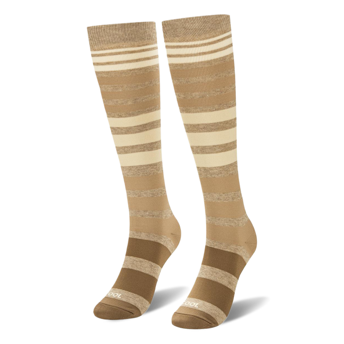 3D display of knee-high socks showing the brown to cream ombre stripes and the word COOL printed near the toe.