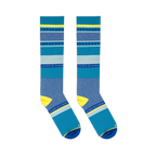Flat lay of two blue and yellow striped knee-high socks positioned parallel to each other against a dark background.