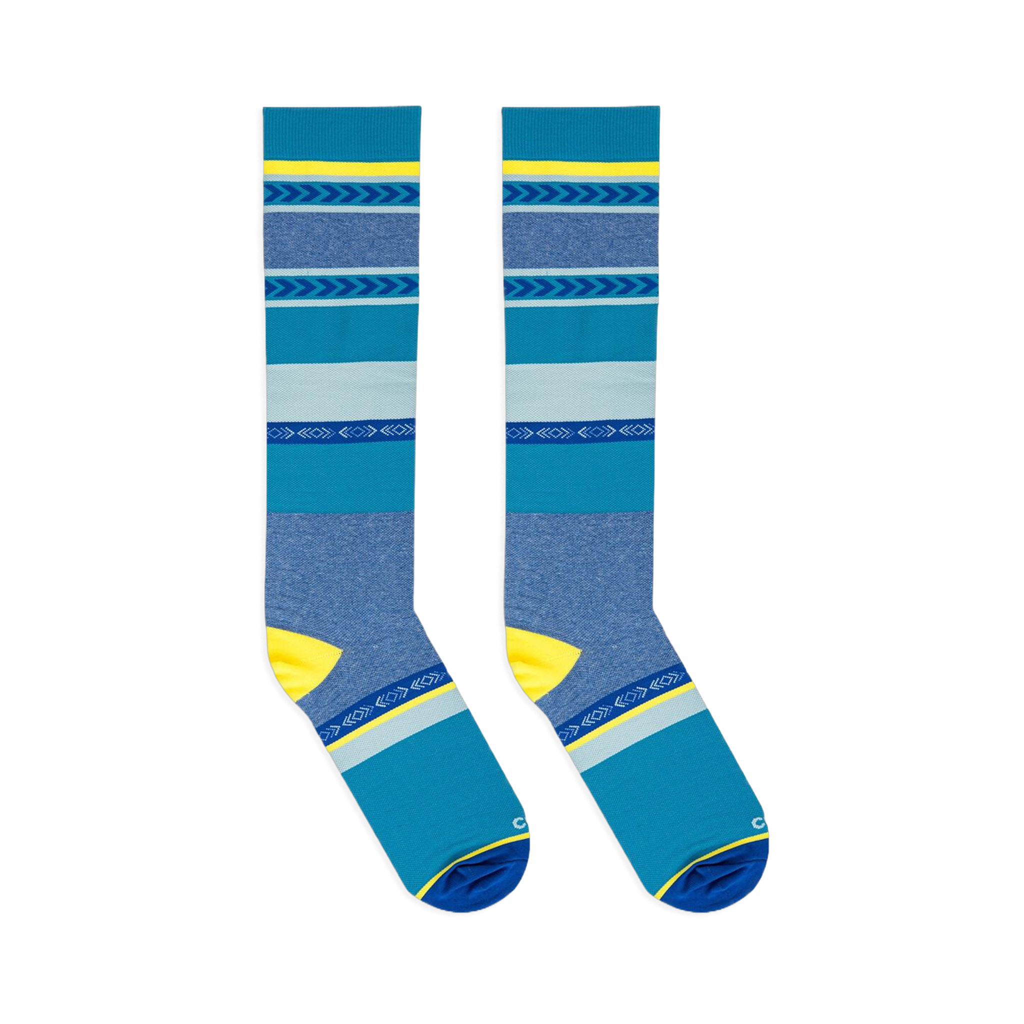 Flat lay of two blue and yellow striped knee-high socks positioned parallel to each other against a dark background.