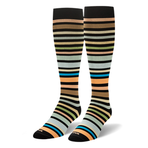 Pair of knee-high socks displayed upright, showing the multi-colored earthy stripes wrapping around the leg and foot.