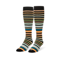 Pair of knee-high socks displayed upright, showing the multi-colored earthy stripes wrapping around the leg and foot.