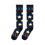 Flat lay of tall navy socks displaying large pale stars alongside top cuffs with bright borders and light blue stars.