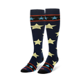 Tall navy blue socks showing large pale yellow stars and striped black cuffs with small light blue stars.
