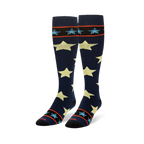 Tall navy blue socks showing large pale yellow stars and striped black cuffs with small light blue stars.