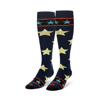 Tall navy blue socks showing large pale yellow stars and striped black cuffs with small light blue stars.