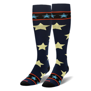 Tall navy blue socks showing large pale yellow stars and striped black cuffs with small light blue stars.
