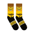 Flat lay view of two yellow and black crew socks showing a cheetah face, sunset tree silhouette, and spotted pattern band.