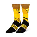 Yellow crew socks with a cheetah face, black savanna tree silhouette, and a black foot featuring a spotted yellow band.