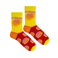 Flat lay of two Lunchables socks on a black background, showing the yellow tops, red foot pattern, and orange heels.