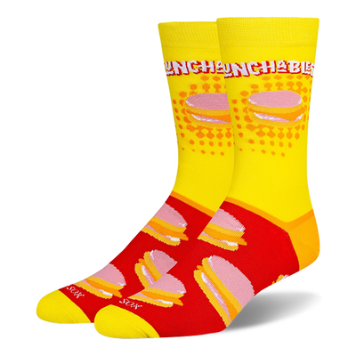 Crew socks featuring a yellow leg with the Lunchables logo and a red foot with a repeating pattern of stacked cracker snacks.