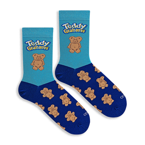 Flat lay of two crew socks. Light blue top with Teddy Grahams logo and one large bear. Navy blue foot with bear pattern.