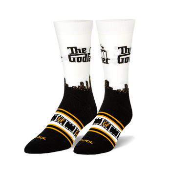 Crew socks with black foot, white calf, black city skyline, "The Godfather" text, and orange/white film strip pattern.