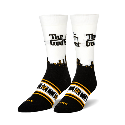Crew socks with black foot, white calf, black city skyline, "The Godfather" text, and orange/white film strip pattern.