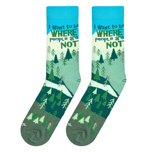 Lifestyle shot: A person's feet wearing the 'Where People Are Not' socks while hiking in nature.