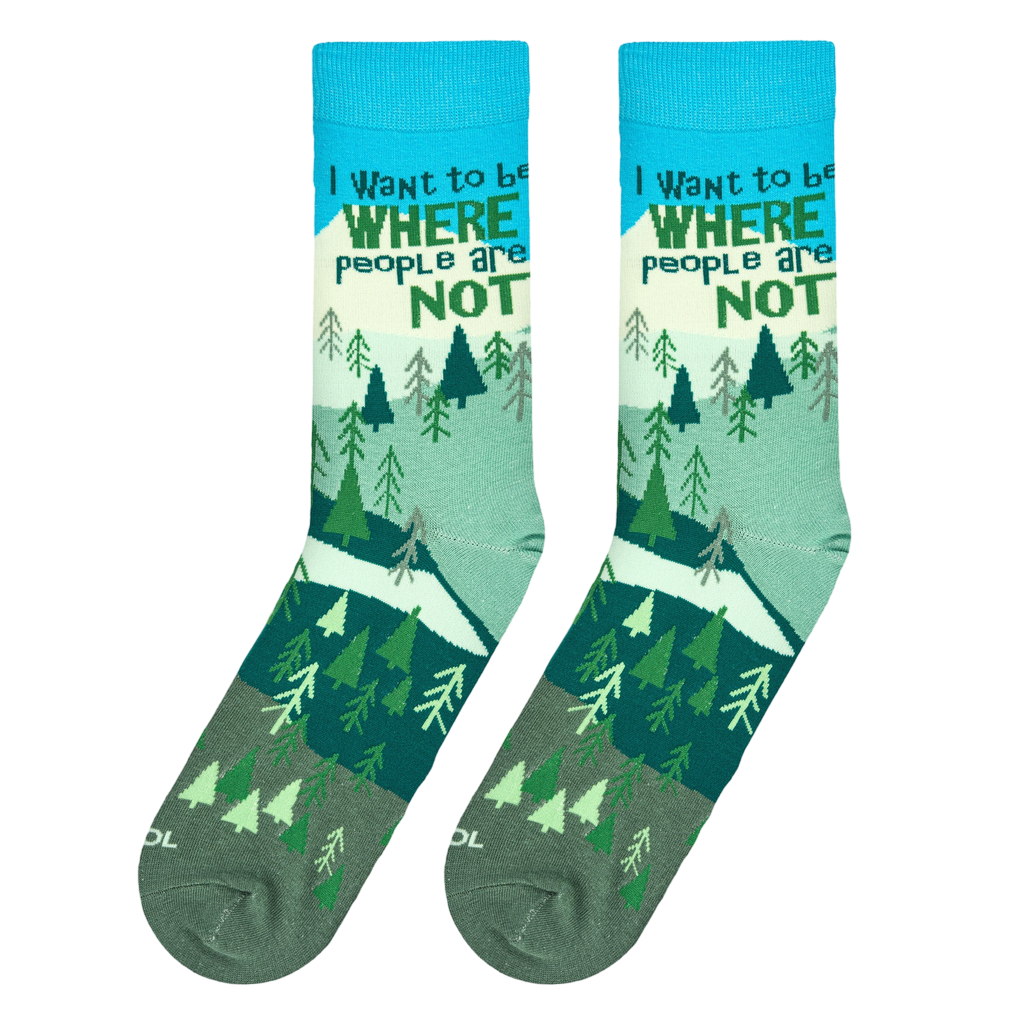 Lifestyle shot: A person's feet wearing the 'Where People Are Not' socks while hiking in nature.