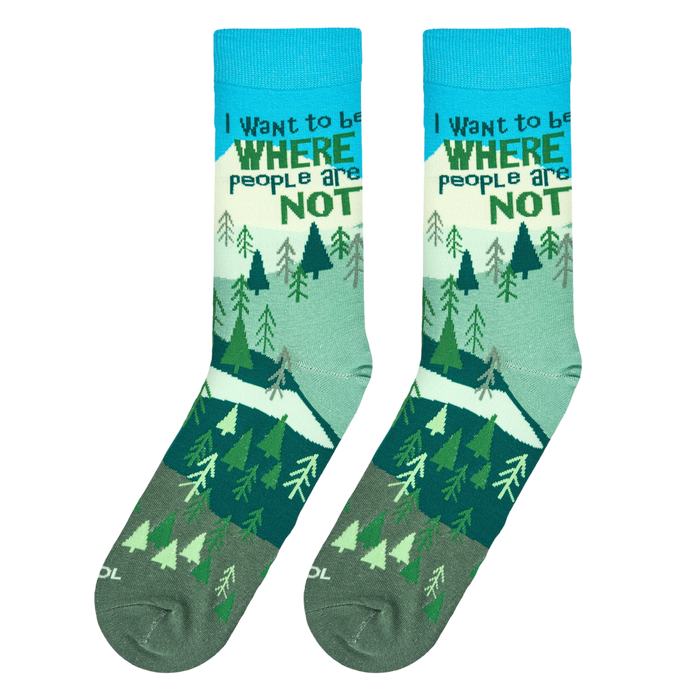 Lifestyle shot: A person's feet wearing the 'Where People Are Not' socks while hiking in nature.