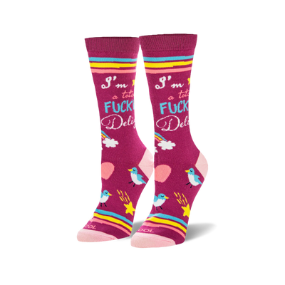 Pair of fuchsia crew socks with "I'm a total FUCKING Delight" text, rainbows, blue birds, yellow stars, and pink hearts.