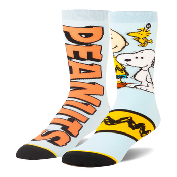 Light blue split crew socks. One has large orange Peanuts text, the other shows Snoopy, Woodstock, and a yellow zigzag.