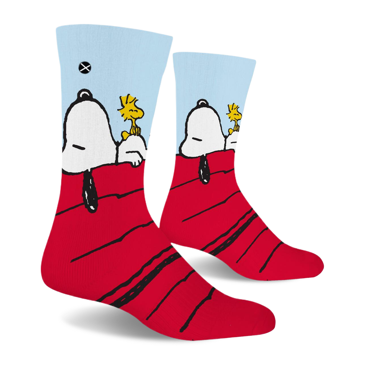 Side view of crew socks showing Snoopy's head and black ear hanging off the red roof while Woodstock sits on his stomach.