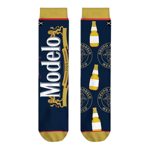 Close-up shot of Modelo Split socks, highlighting the detailed Modelo logo and bottle design.