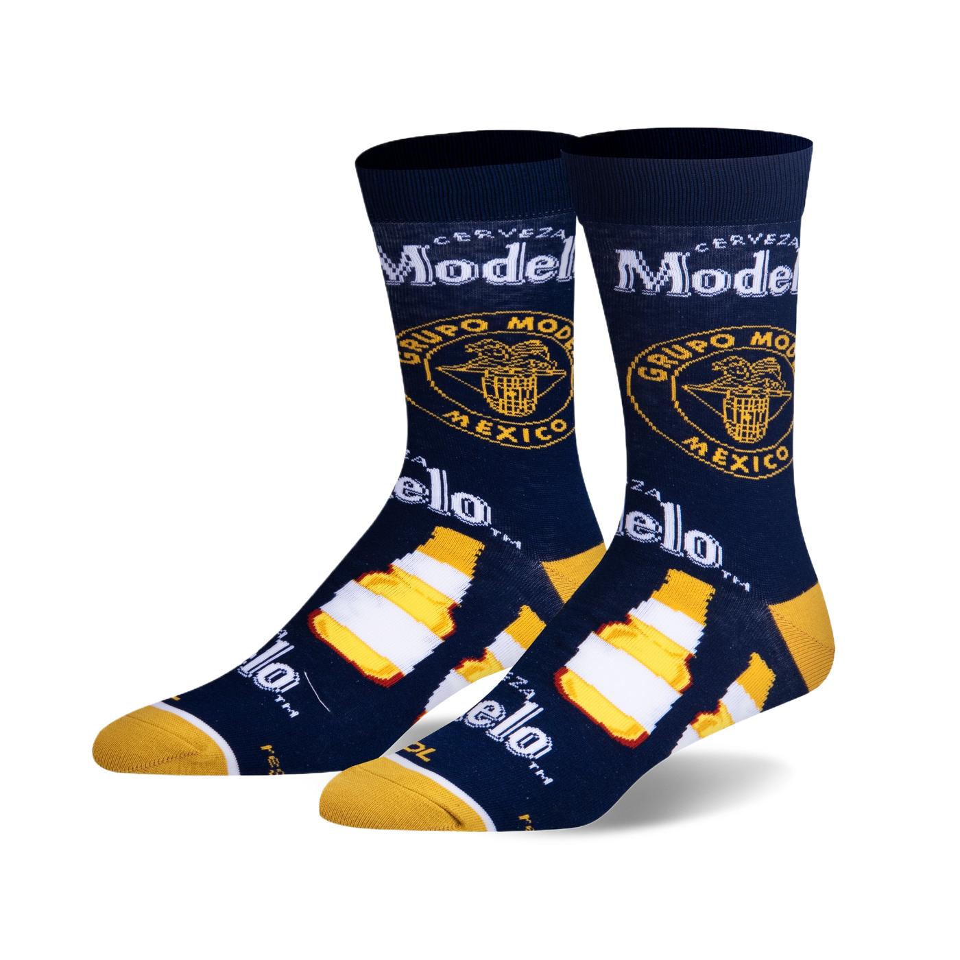 Pair of crew socks in navy blue, featuring Modelo beer bottle and logo graphics in yellow and white.