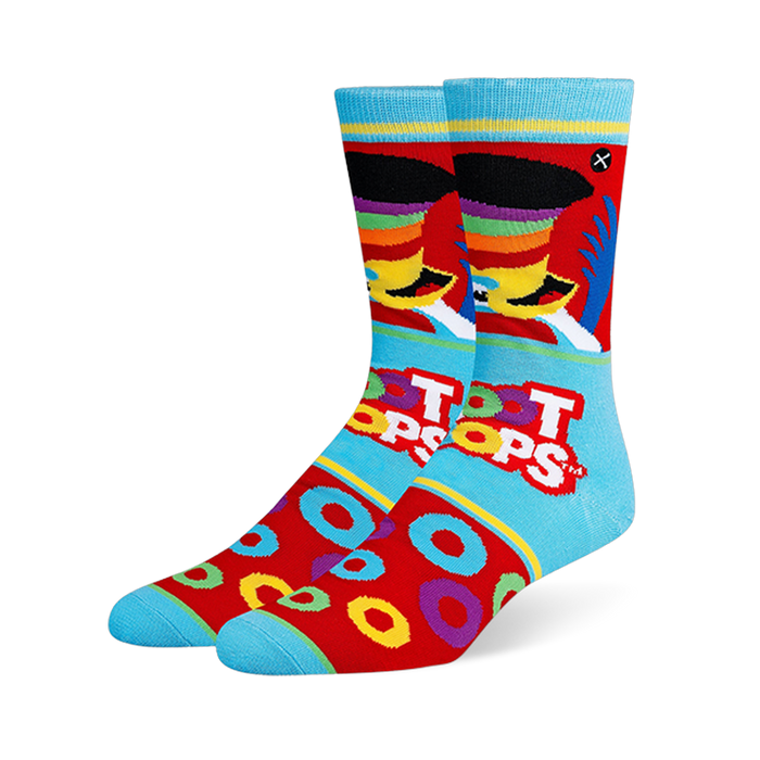 Light blue and red crew socks featuring Toucan Sam, the Froot Loops logo, scattered cereal rings, and bright blue toes.