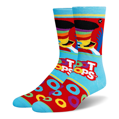Light blue and red crew socks featuring Toucan Sam, the Froot Loops logo, scattered cereal rings, and bright blue toes.