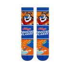 Flat lay of two crew socks showing Tony the Tiger, the Frosted Flakes logo, and a cereal bowl design on an orange base.