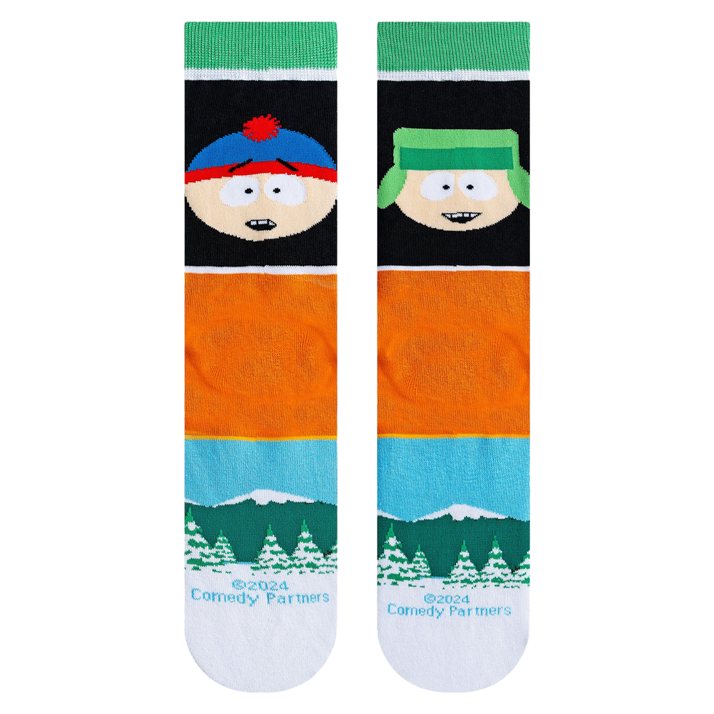 Close-up product shot highlighting the South Park characters, text, and snowy mountain landscape on the socks.
