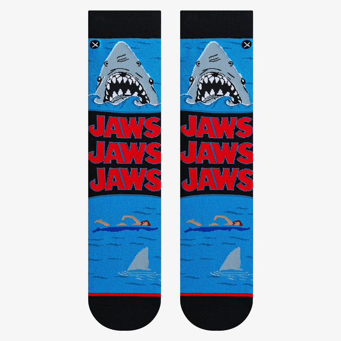 Flatlay showcasing a pair of Jaws Mash Up crew socks; highlighting the sock's design details.