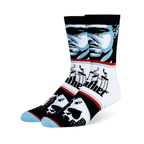 Crew socks with a blue and black Godfather portrait, the classic puppeteer logo, and playing cards over a city skyline.