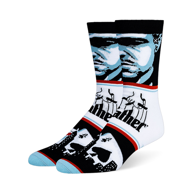 Crew socks with a blue and black Godfather portrait, the classic puppeteer logo, and playing cards over a city skyline.