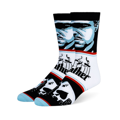 Crew socks with a blue and black Godfather portrait, the classic puppeteer logo, and playing cards over a city skyline.