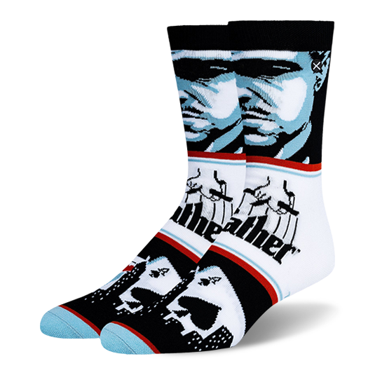 Crew socks with a blue and black Godfather portrait, the classic puppeteer logo, and playing cards over a city skyline.