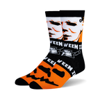 Pair of black crew socks with orange and white Halloween designs. Features Michael Myers' face and jack-o'-lantern faces.