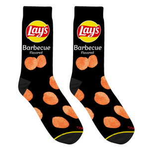 Close-up studio shot of a pair of black Lay's BBQ socks, highlighting the chip design and sock texture.